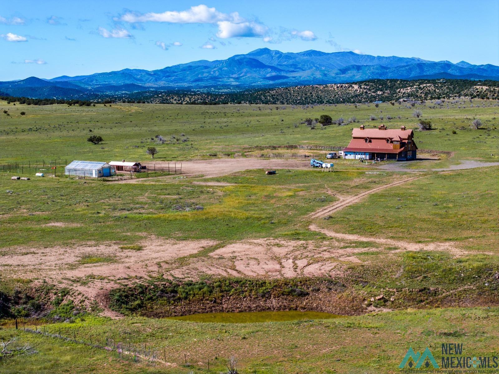 398 Pine Road Capitan, NM 88316 - Photo 50 of 68 View of mountain backdrop with rural landscape and agricultural land
