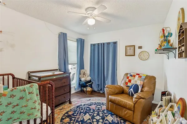 a bedroom with furniture and a chandelier