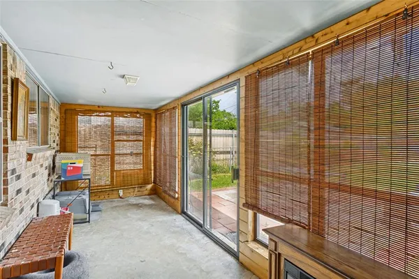 a view of game room with windows