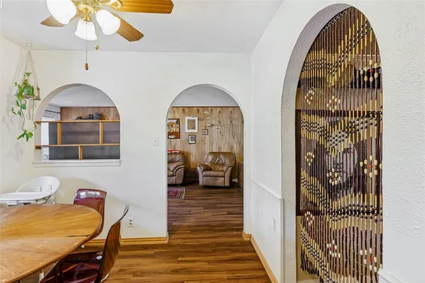 a view of hall way with furniture