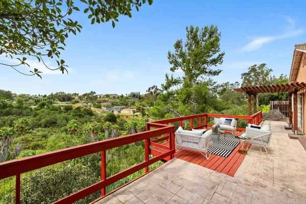 a view of sitting space and swimming pool in the balcony