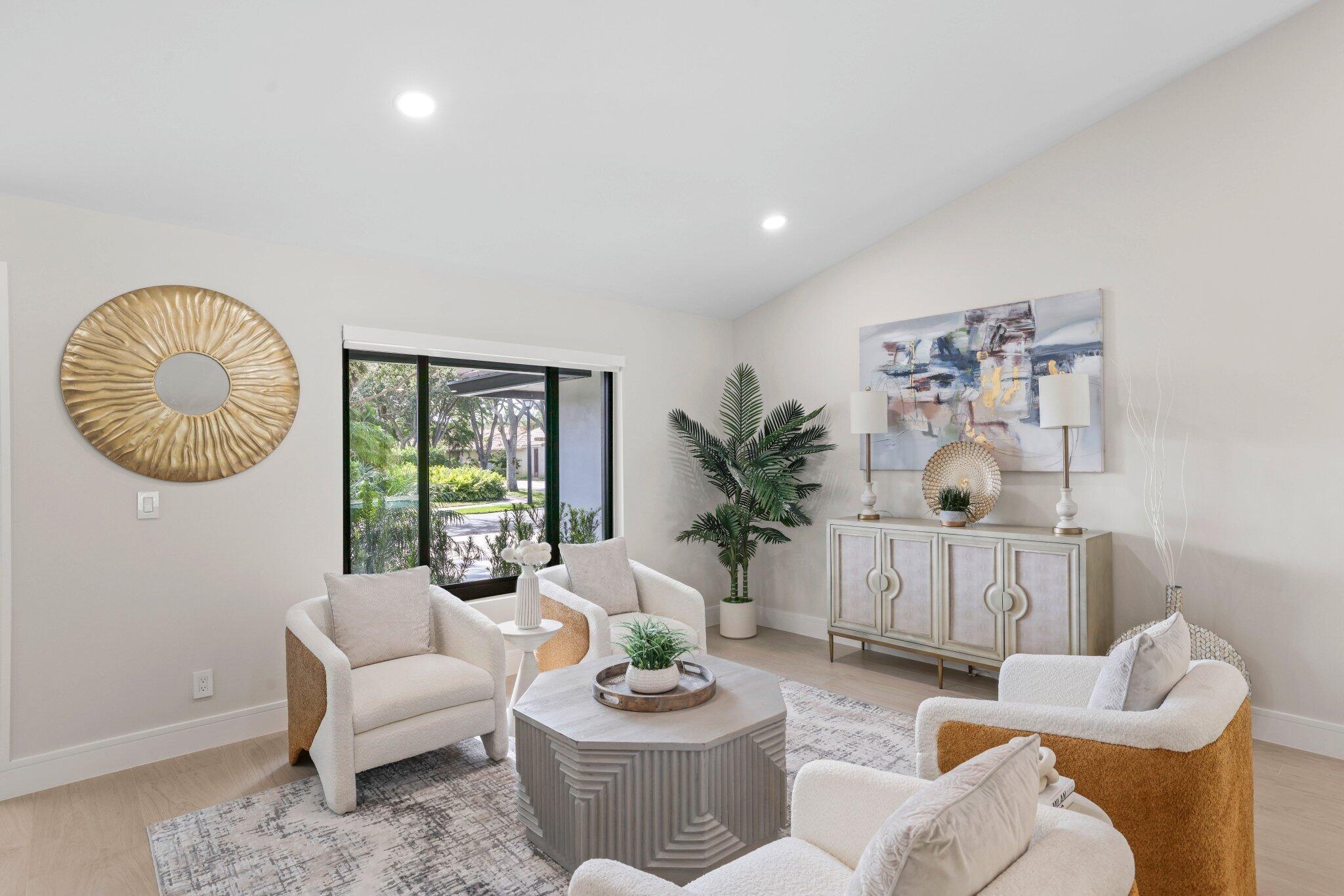 3901 Northwest 27th Avenue Boca Raton, FL 33434 - Photo 7 of 56 a living room with furniture and a window