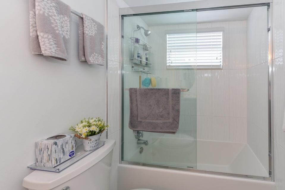 2860 South Ocean Boulevard, Unit 202 Palm Beach, FL 33480 - Photo 18 of 33 a bathroom with a window a sink and a shower