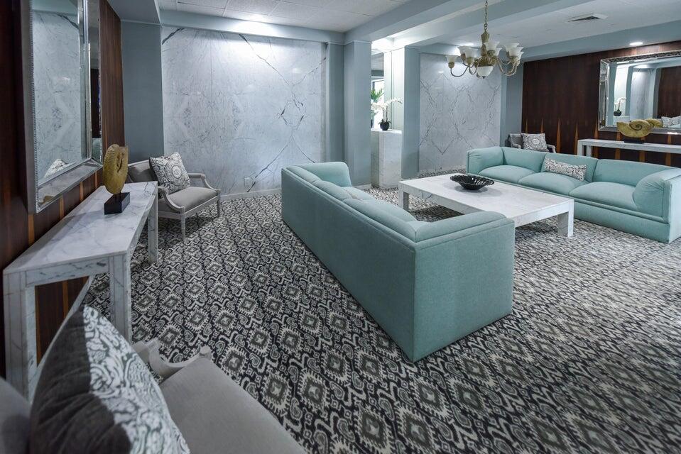 2860 South Ocean Boulevard, Unit 202 Palm Beach, FL 33480 - Photo 31 of 33 a living room with furniture and a fireplace