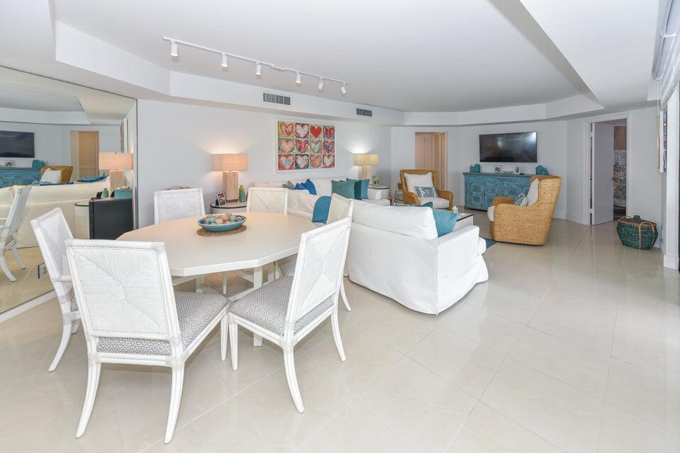 2860 South Ocean Boulevard, Unit 202 Palm Beach, FL 33480 - Photo 7 of 33 a dining room with furniture and wooden floor