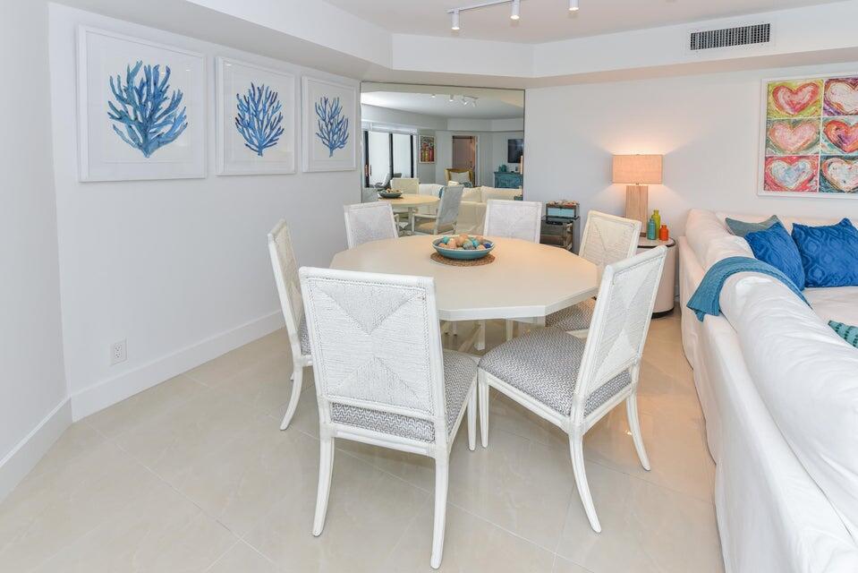 2860 South Ocean Boulevard, Unit 202 Palm Beach, FL 33480 - Photo 8 of 33 a dining room with furniture and wooden floor