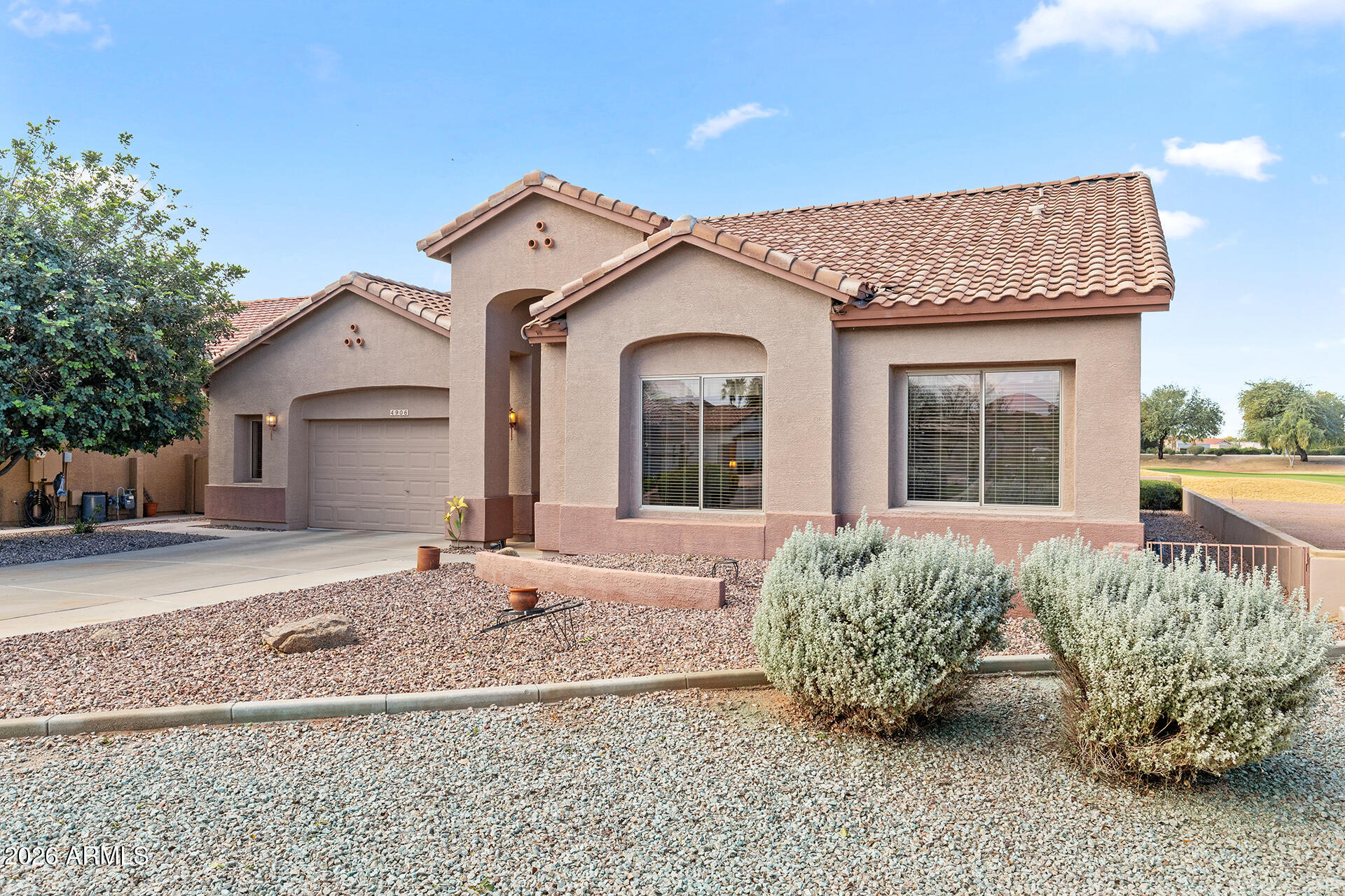 4906 South Verbena Avenue Gilbert, AZ 85298 - Photo 1 of 46 a view of a house with a garden and pathway