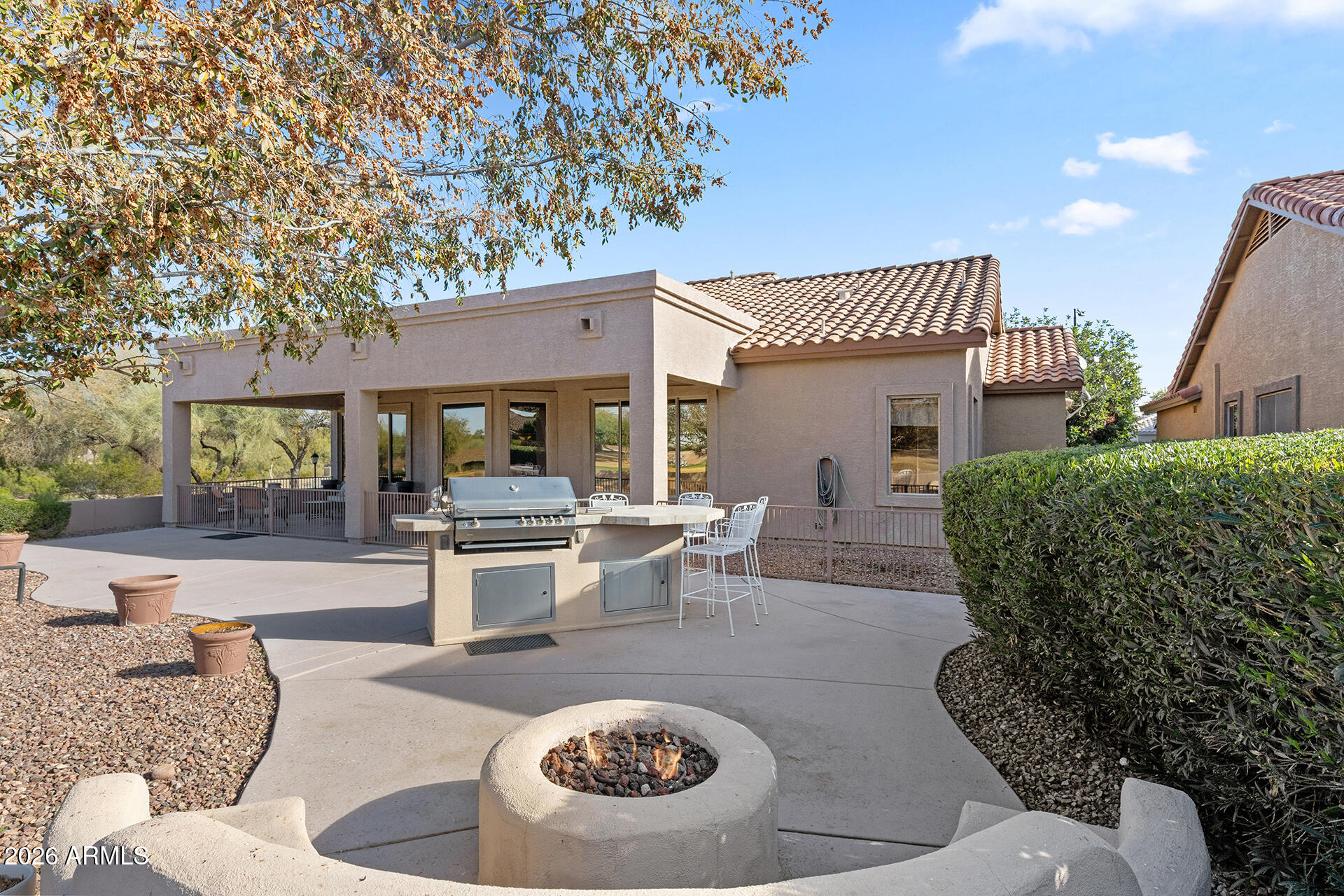 4906 South Verbena Avenue Gilbert, AZ 85298 - Photo 21 of 46 a view of a house with backyard and sitting area