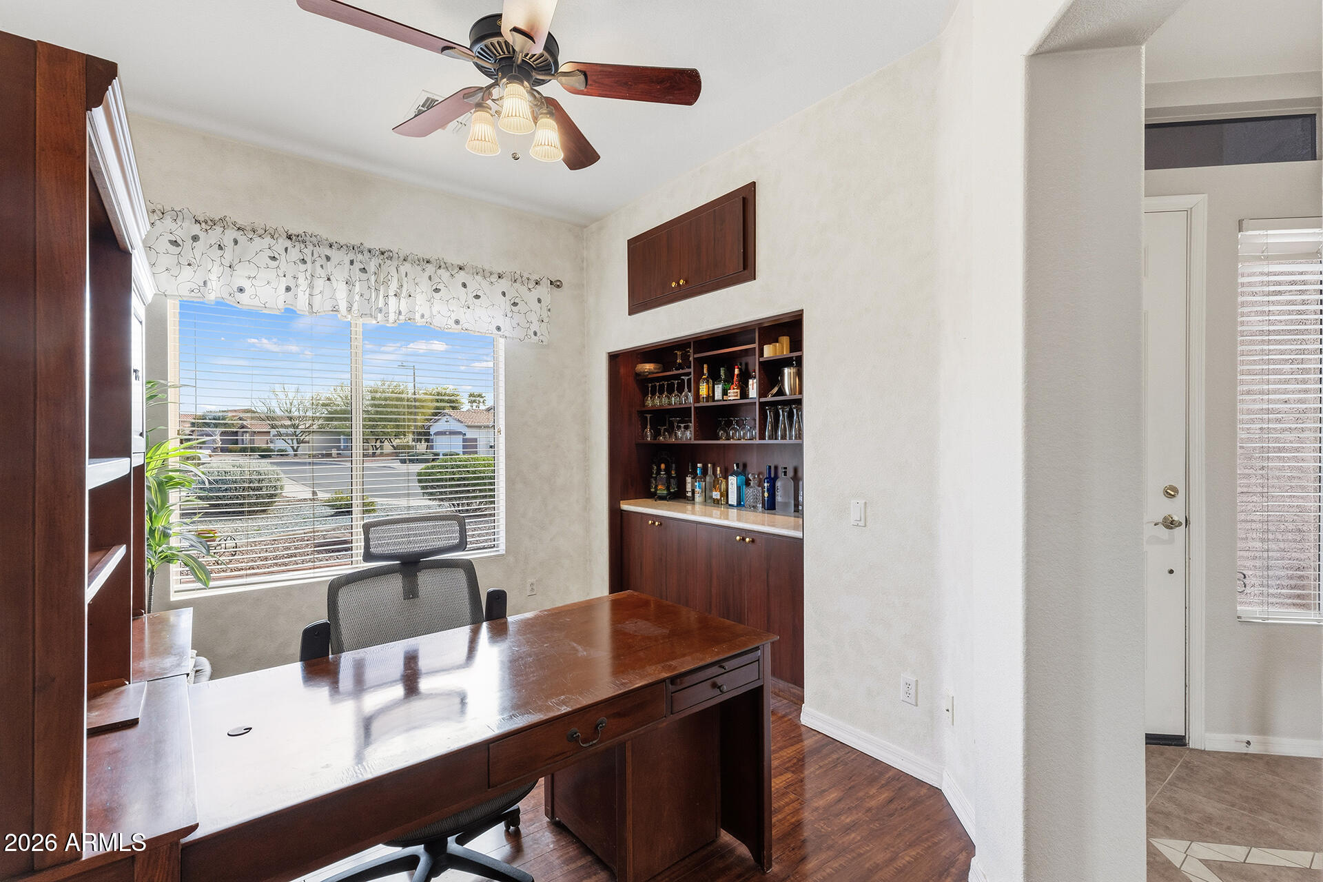 4906 South Verbena Avenue Gilbert, AZ 85298 - Photo 3 of 46 a view of a workspace with furniture and a window