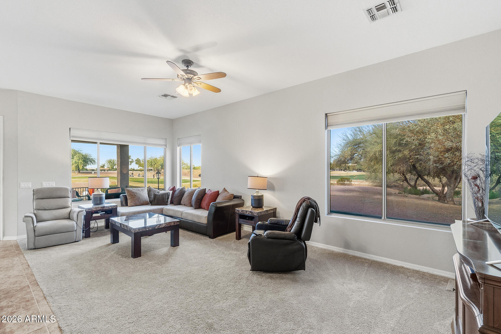 4906 South Verbena Avenue Gilbert, AZ 85298 - Photo 6 of 46 a living room with furniture and a large window