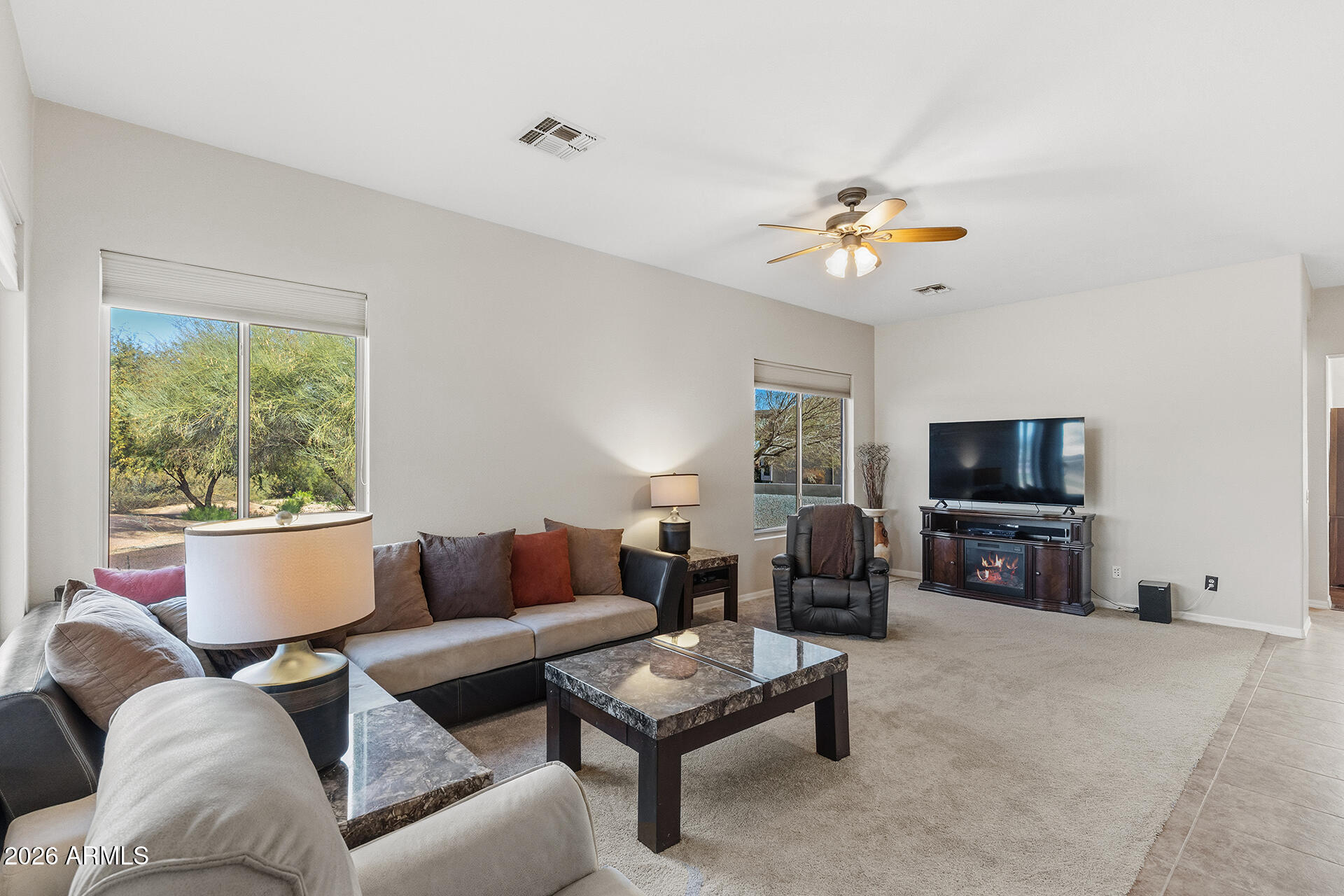 4906 South Verbena Avenue Gilbert, AZ 85298 - Photo 7 of 46 a living room with furniture and a flat screen tv