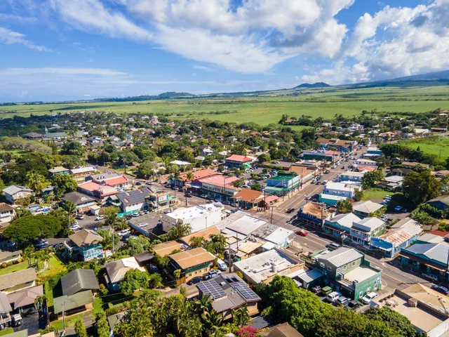 an aerial view of city and lake