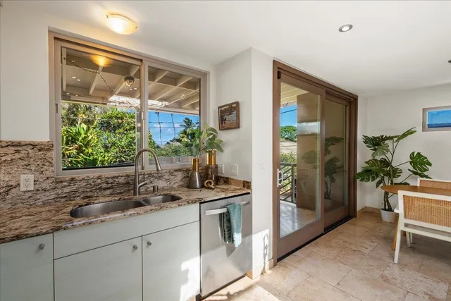 a kitchen with a sink and large window