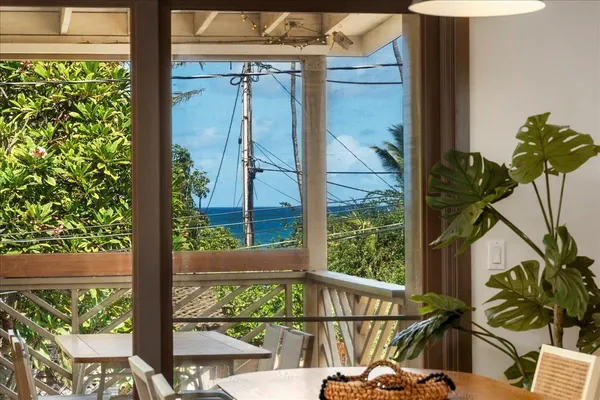 a view of a balcony with wooden floor