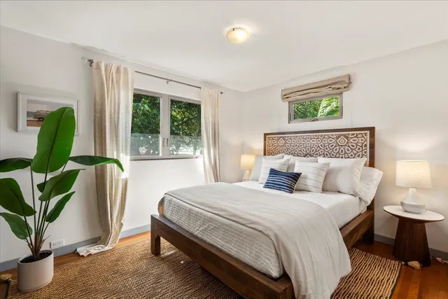 a bedroom with a bed and a lamp