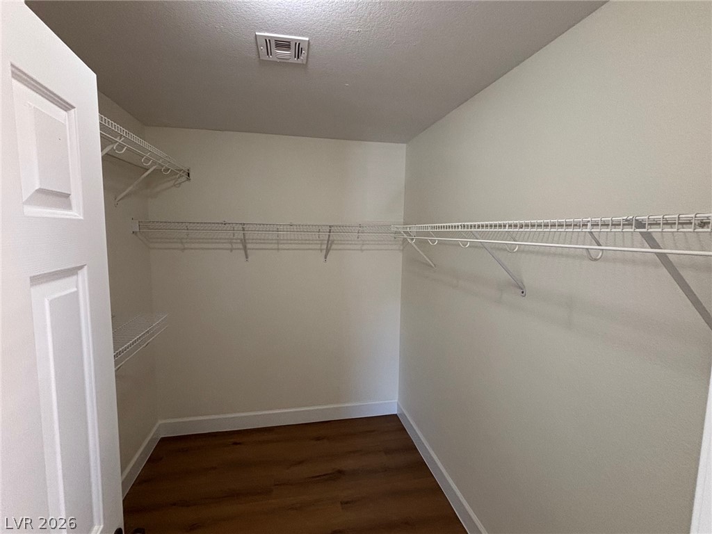 4900 Naff Ridge Drive Las Vegas, NV 89131 - Photo 14 of 21 Ample wire shelving and rich flooring complete this functional walk-in closet.