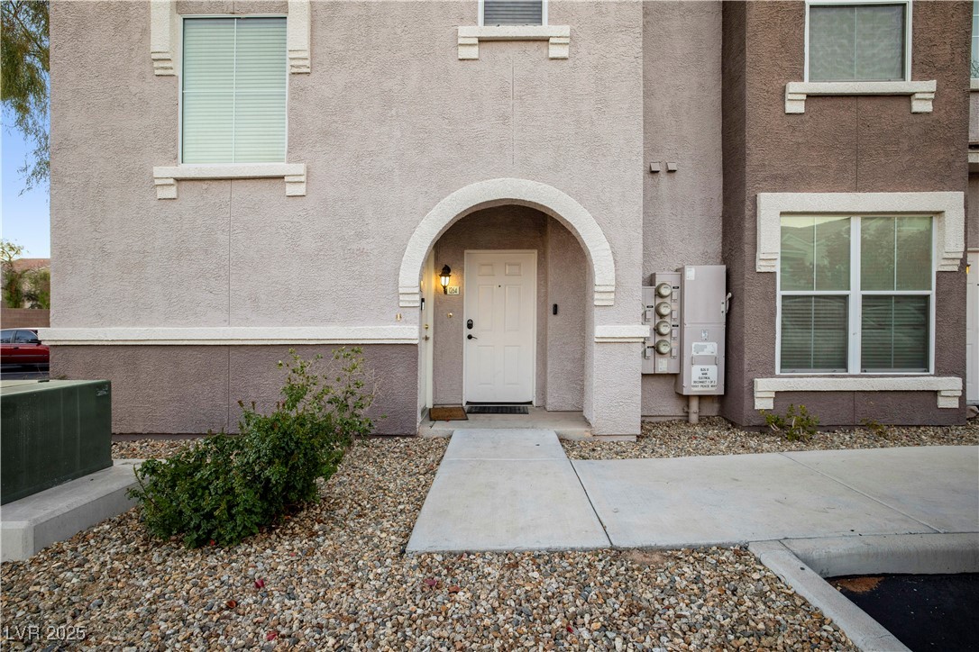 10001 Peace Way, Unit 1264 Las Vegas, NV 89147 - Photo 21 of 27 Doorway to property with stucco siding