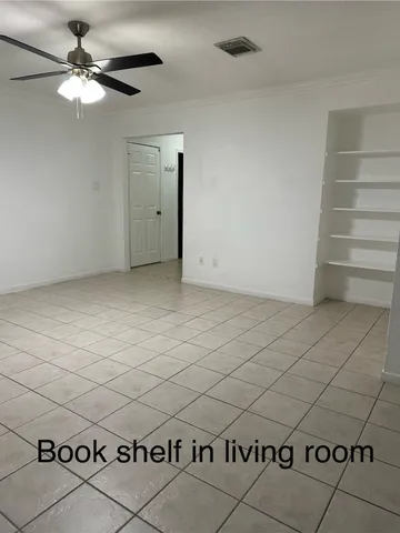 a kitchen with granite countertop cabinets stainless steel appliances and a window
