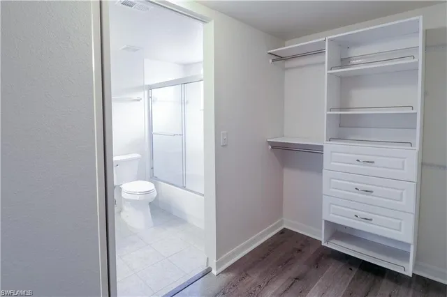 a view of an empty walk in closet