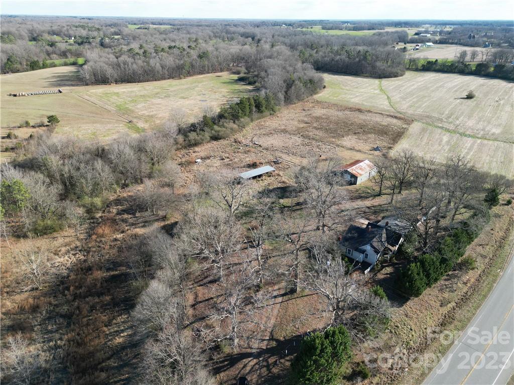 6508 Concord Highway Monroe, NC 28110 - Photo 2 of 9 a view of a dry yard with wooden fence