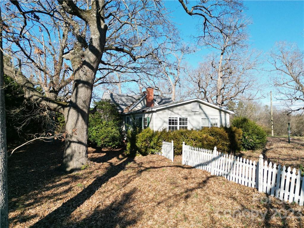 6508 Concord Highway Monroe, NC 28110 - Photo 7 of 9 a view of a house with a yard covered in snow