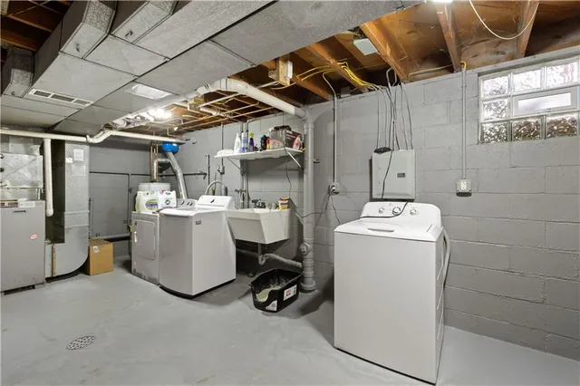 a utility room with dryer and washer