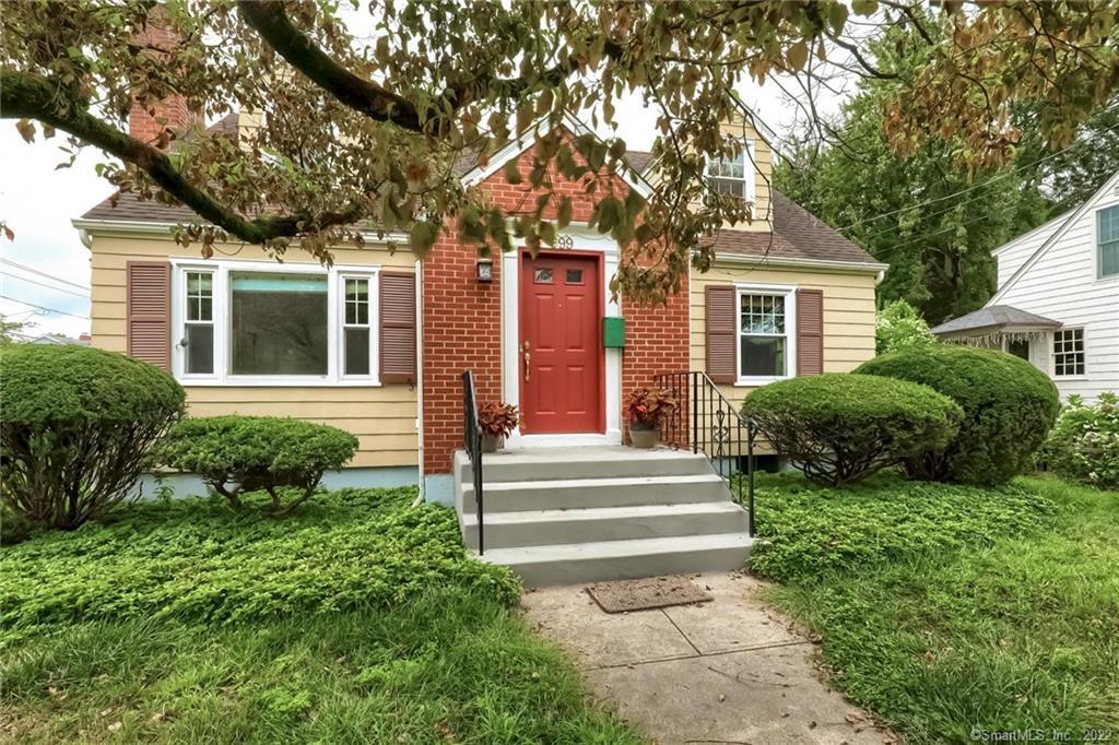 a front view of a house with a yard