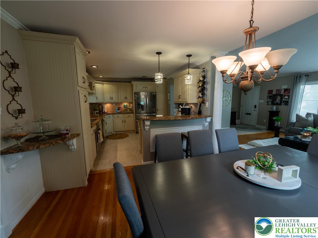 2087 Hopewell Road Bethlehem, PA 18017 - Photo 12 of 38 An inviting open-concept layout connects the well-appointed kitchen to a bright dining space.