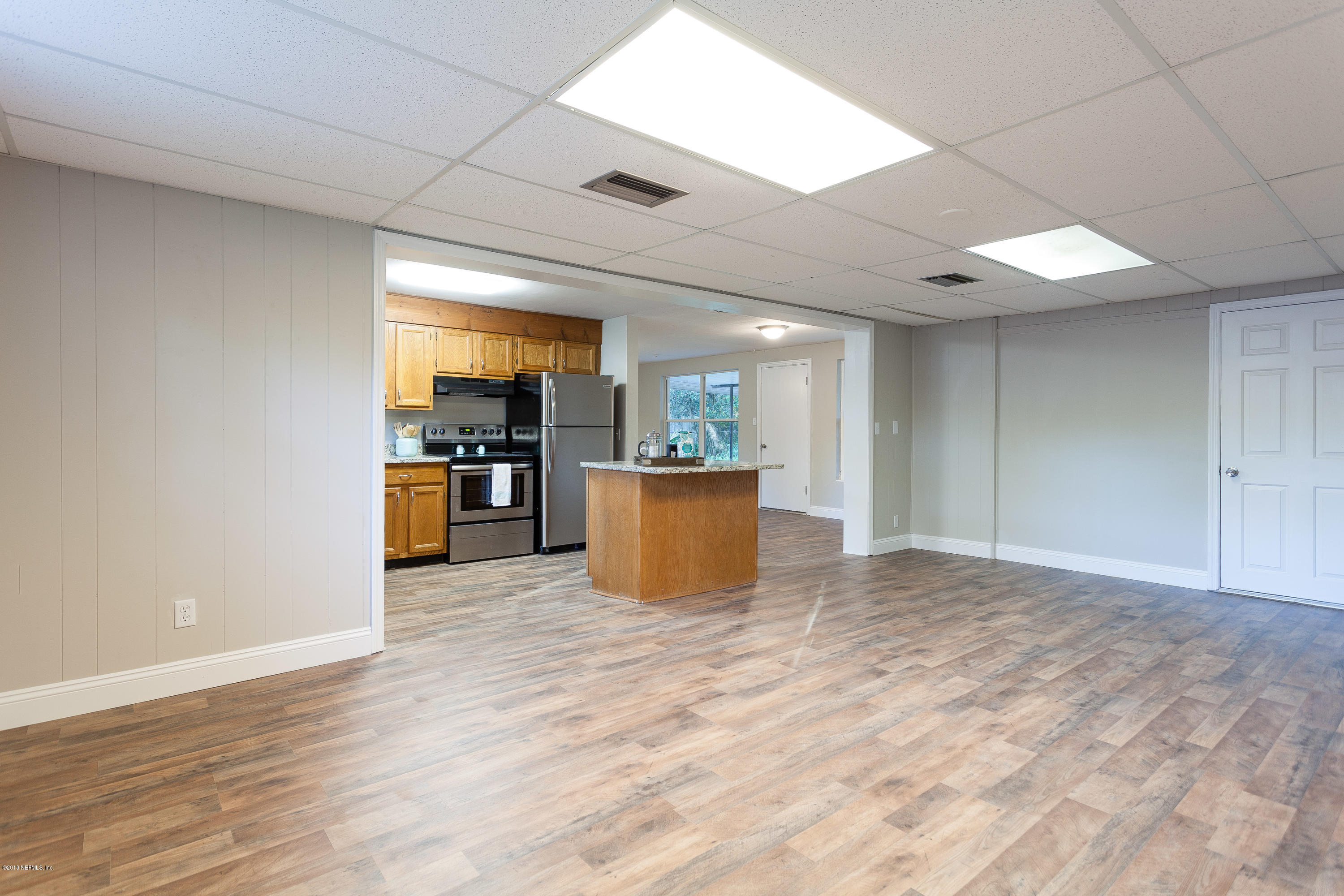 4230 Springwood Road Jacksonville, FL 32207 - Photo 7 of 20 a view of a kitchen with a sink and a refrigerator