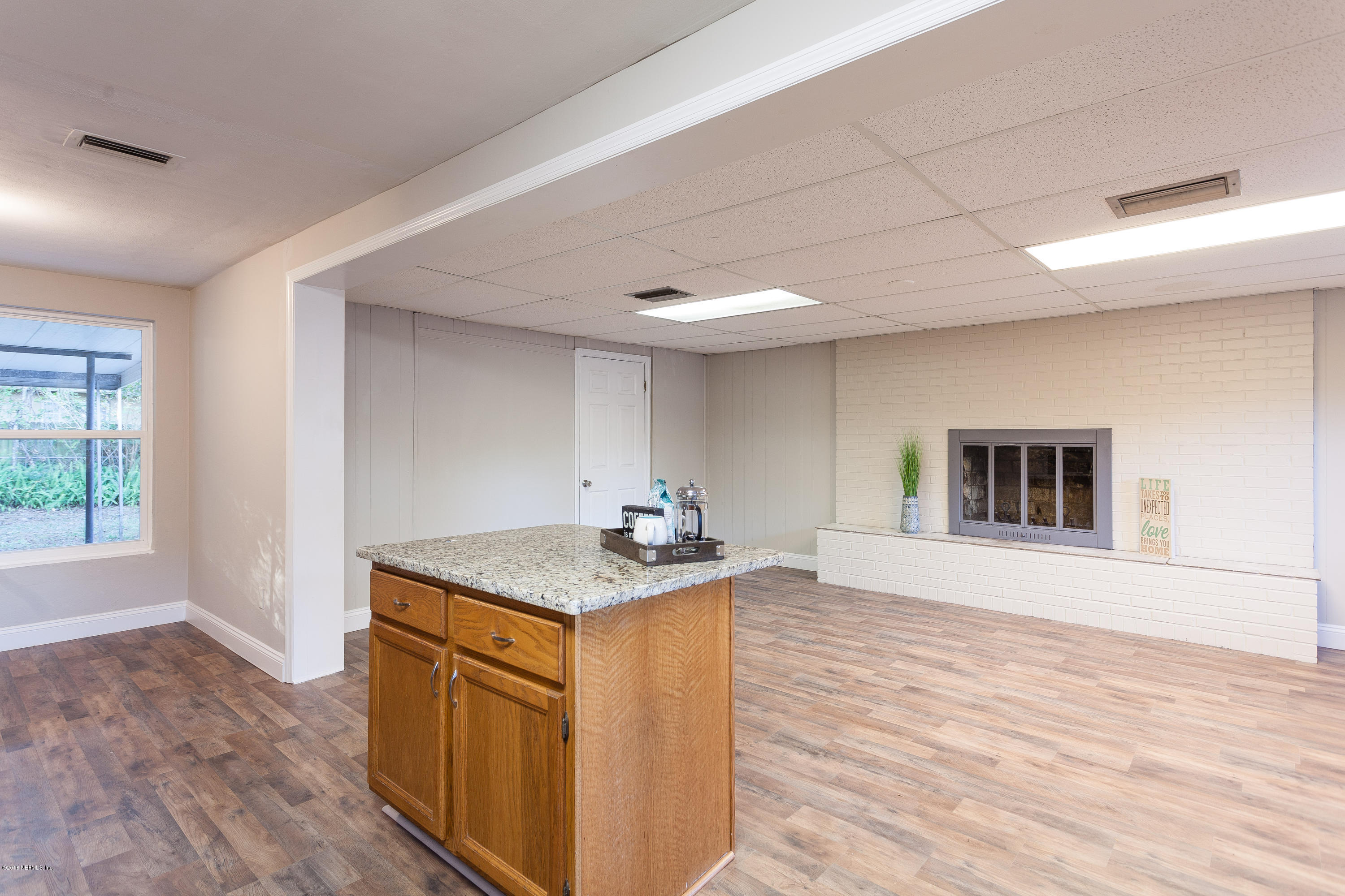 4230 Springwood Road Jacksonville, FL 32207 - Photo 8 of 20 a kitchen with a sink and a stove top oven