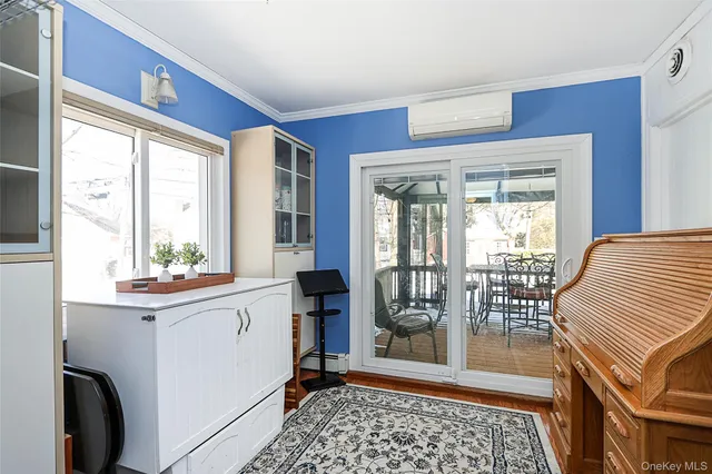 a view of a hallway and a livingroom with furniture