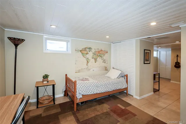 a bedroom with a bed and a table in it