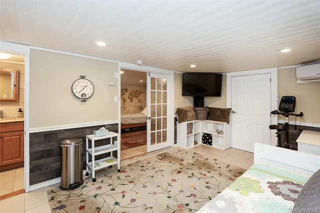 a bedroom with furniture and view of kitchen