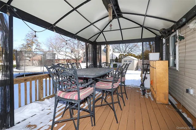 a view of a chairs and table in the balcony