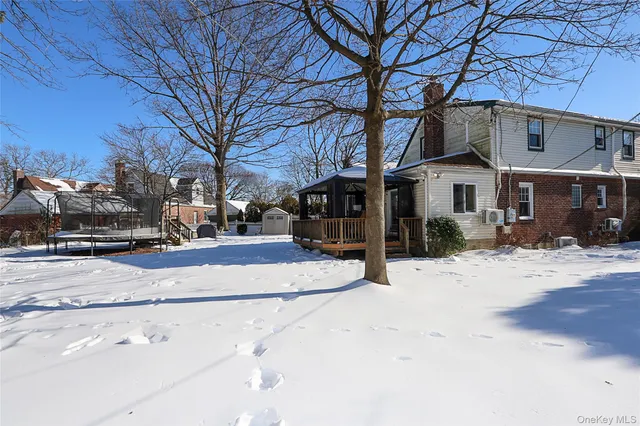 a street view with a building in snow