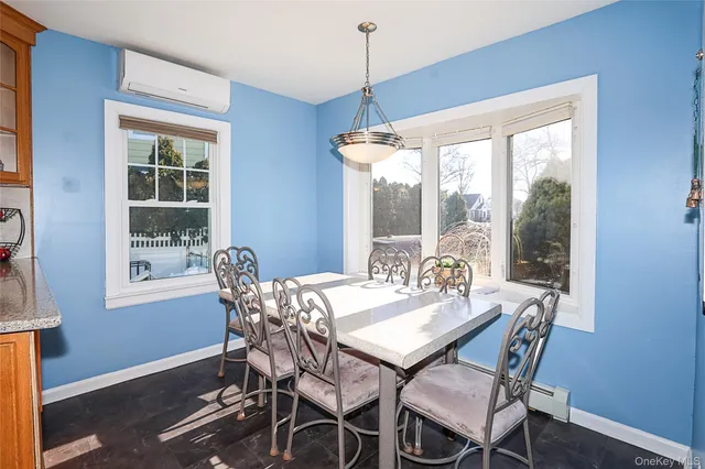 a view of a dining room with furniture window and outside view