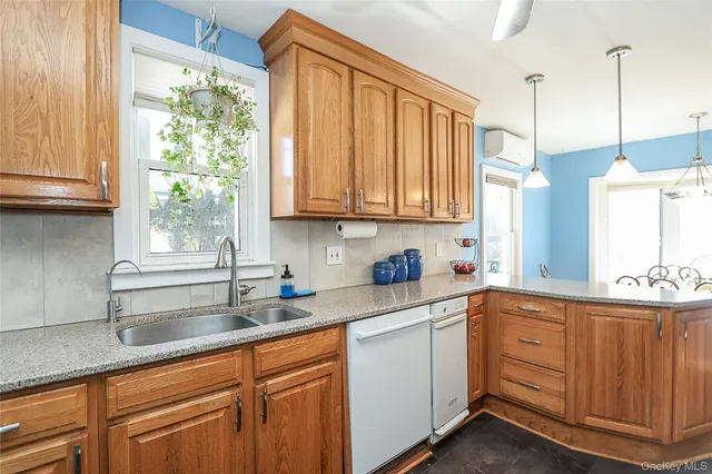 a kitchen with sink cabinets and window