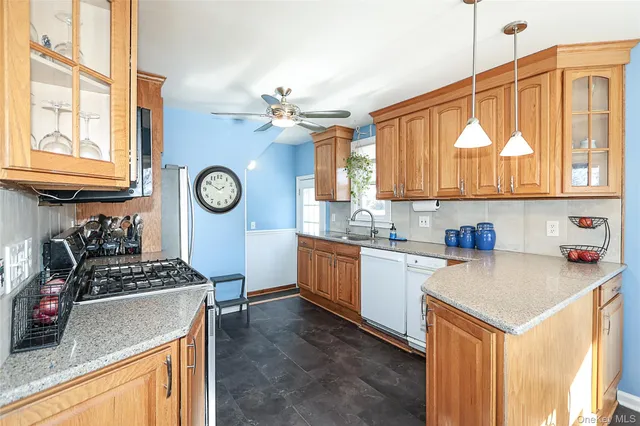 a kitchen with a sink cabinets and window