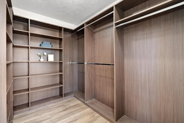 a bathroom with a bathtub and next to a window