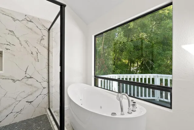 a bathroom with double vanity sink and a mirror