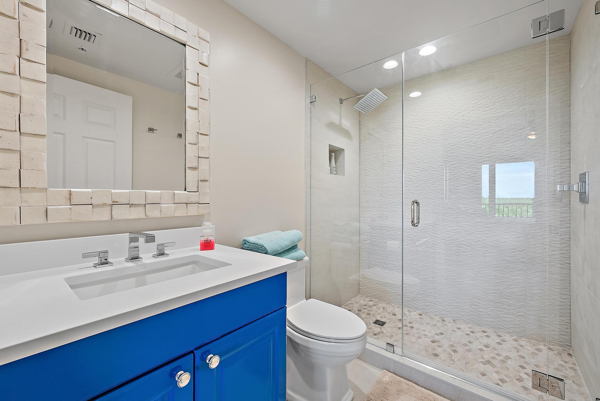 500 Highway 1, Unit 402 Jupiter, FL 33477 - Photo 23 of 38 a bathroom with a sink toilet and shower