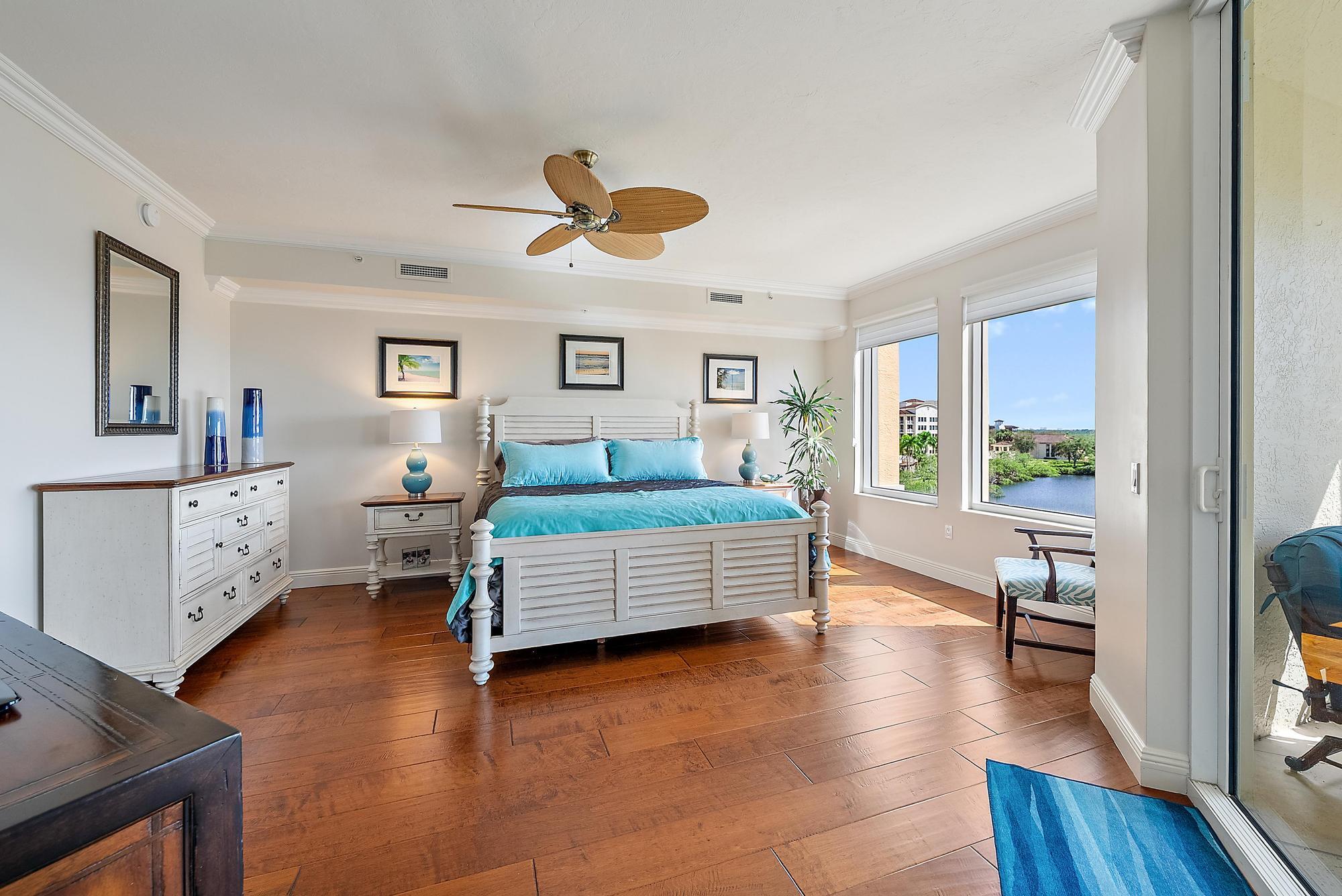 500 Highway 1, Unit 402 Jupiter, FL 33477 - Photo 3 of 38 a bedroom with furniture and a wooden floor