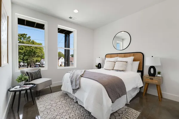 a bedroom with bed and a window