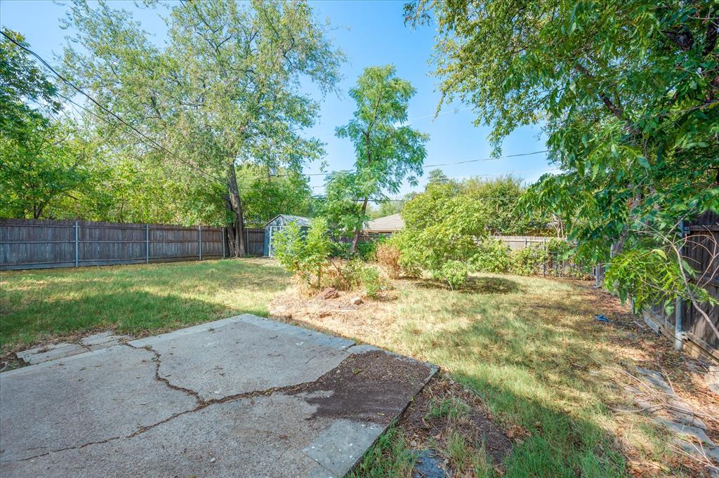 1902 Alan-A-Dale Road Arlington, TX 76013 - Photo 25 of 28 a view of a backyard with tree s