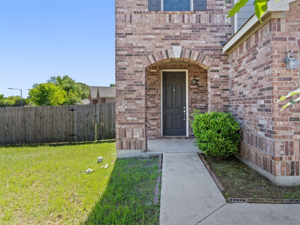 7633 Rio Pass Austin, TX 78724 - Photo 2 of 23 Entrance to property with brick siding