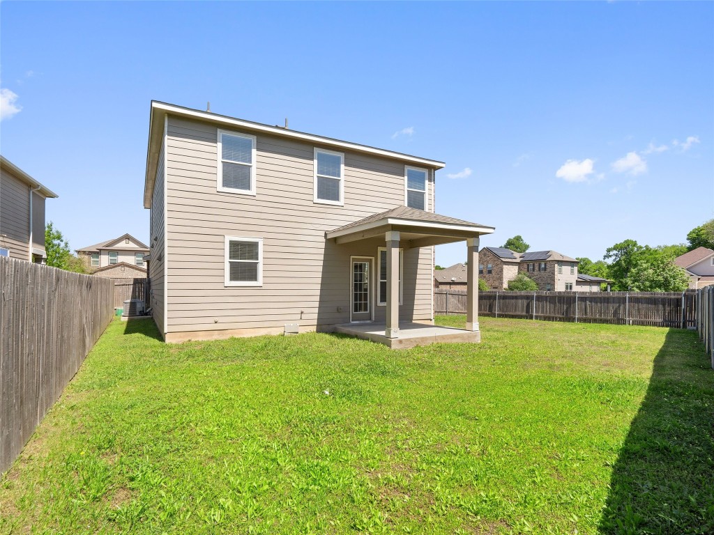 7633 Rio Pass Austin, TX 78724 - Photo 20 of 23 Back of house featuring a patio and a fenced backyard