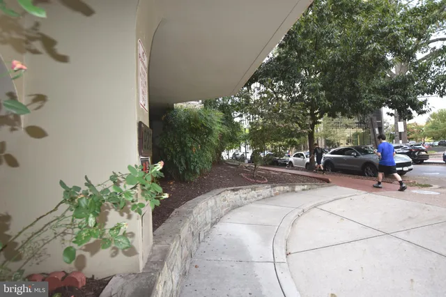 a swimming pool with outdoor seating and plants