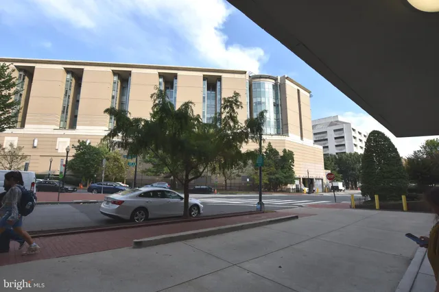 a view of multiple houses with tree s
