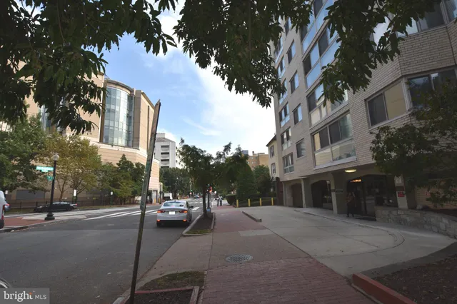 a view of a street with a building in the background