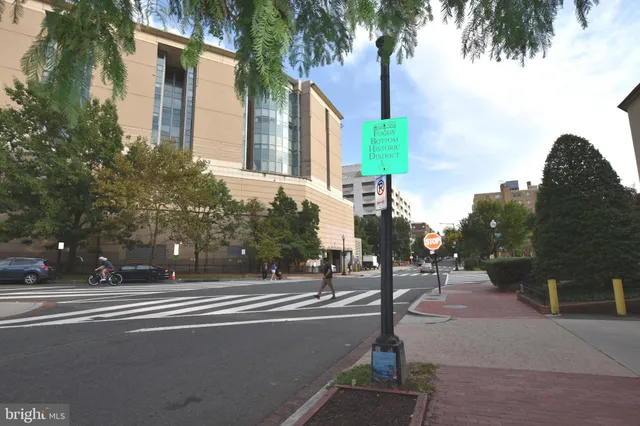 a front view of a building with parking